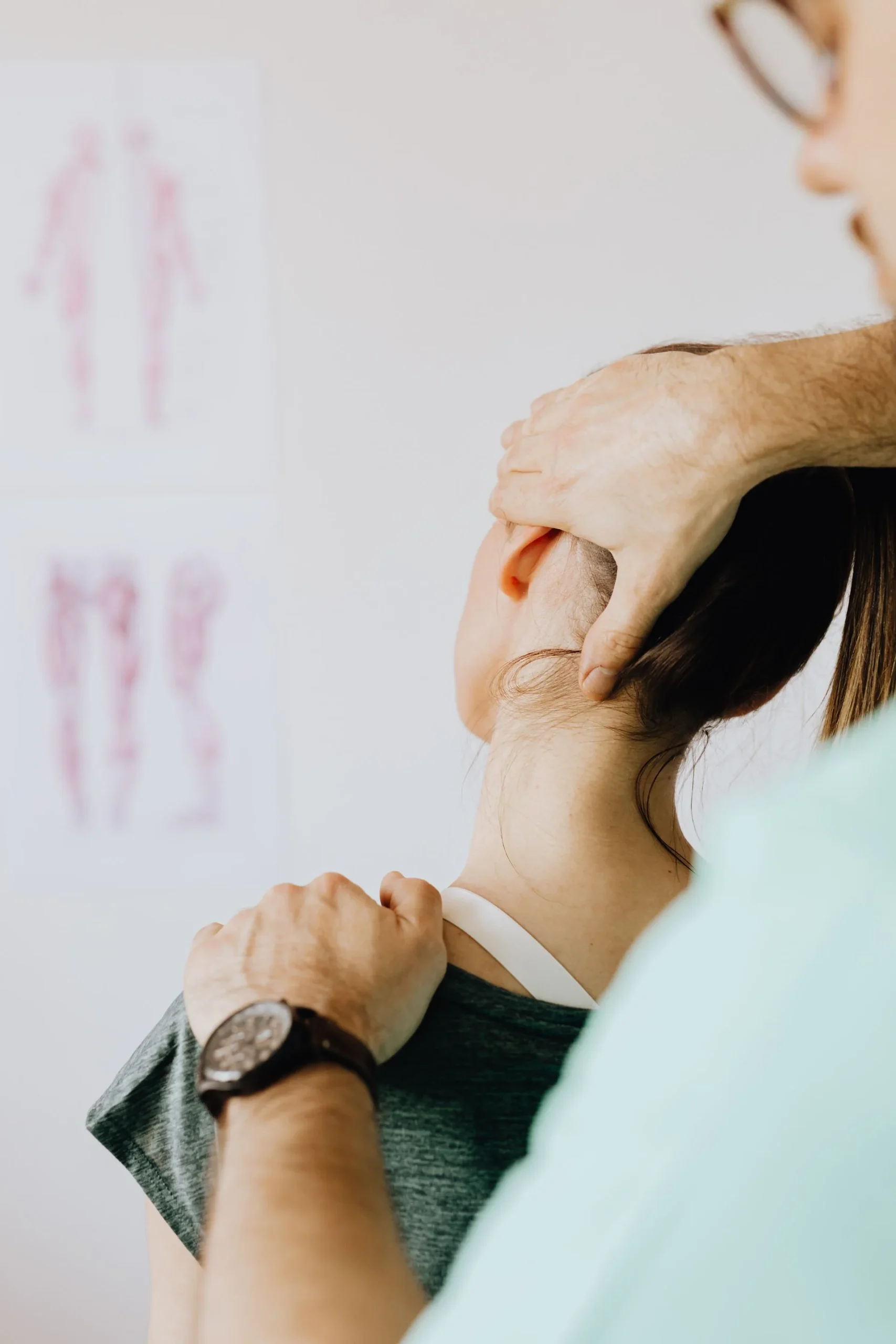 Practitioner evaluating neck mobility