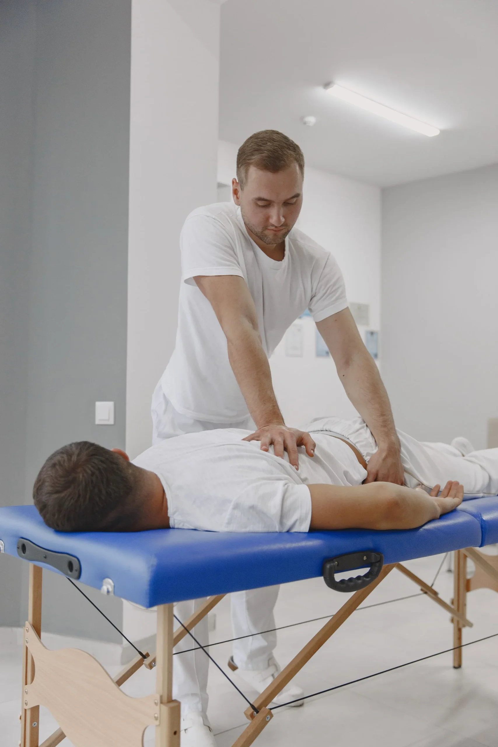 Practitioner providing hands-on back care