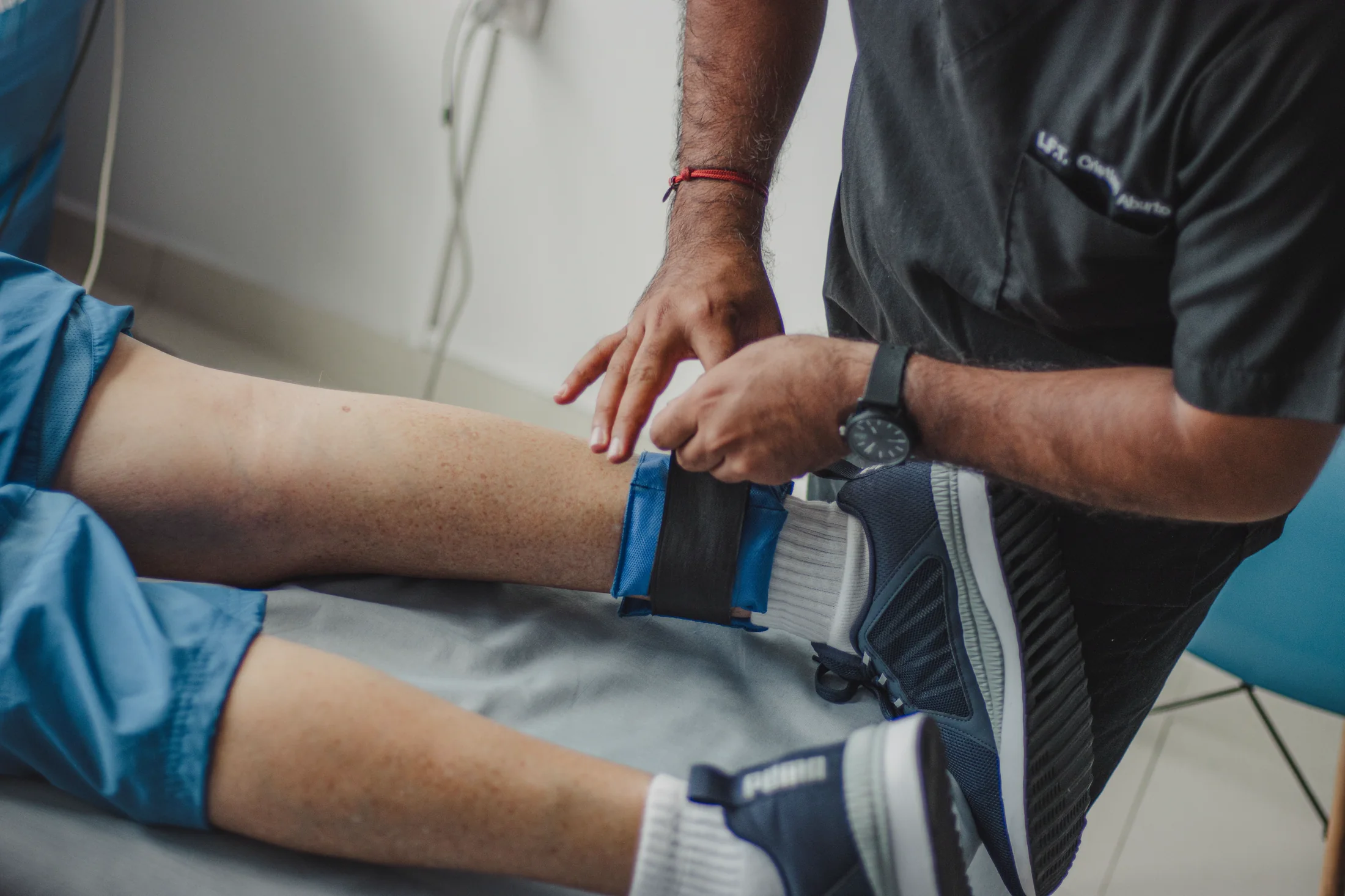 Patient positioned on a therapy table with clinical support equipment
